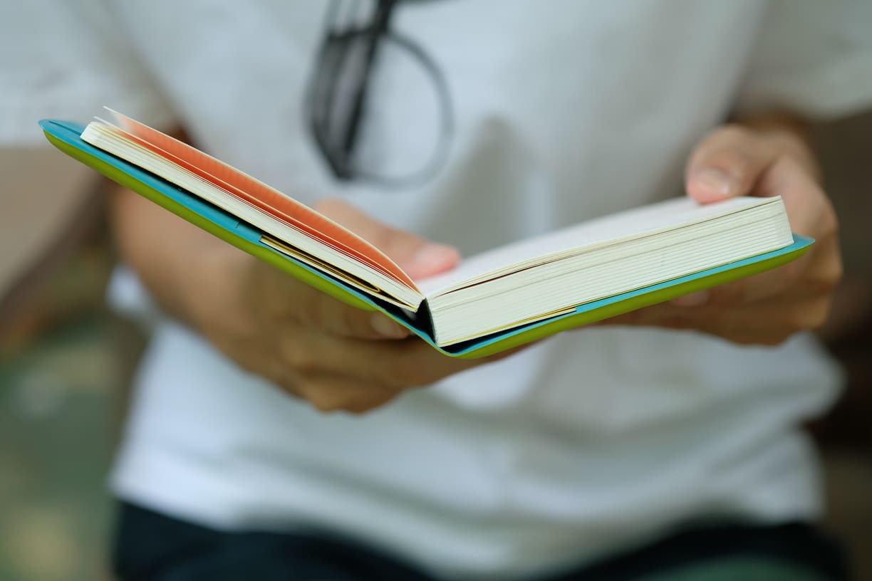 woman-white-shirt-holding-book-read-business-concept-business-idea